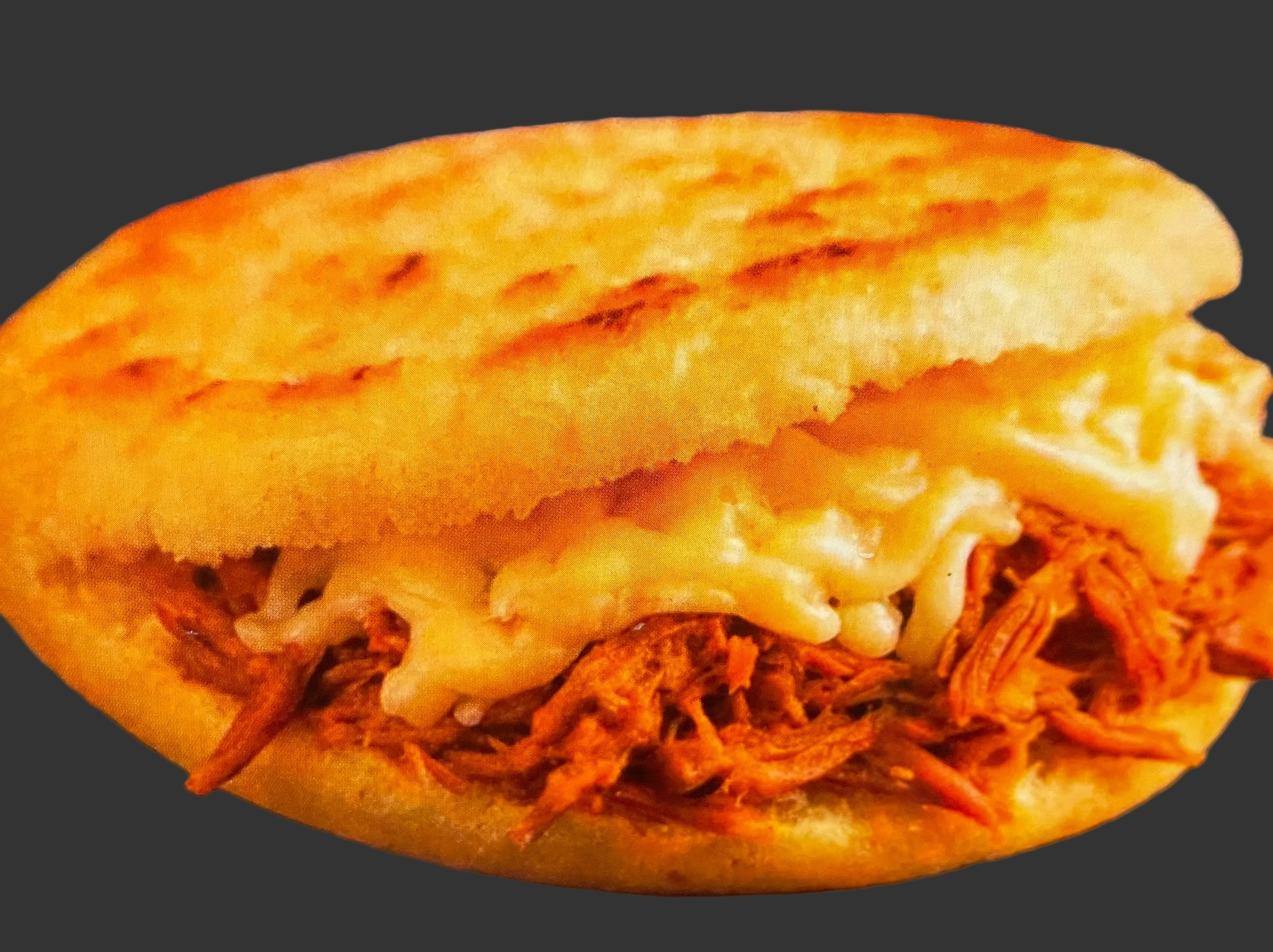 Sample of sweet corn Colombian arepa (Chocolo arepa) stuffed with meat and cheese.